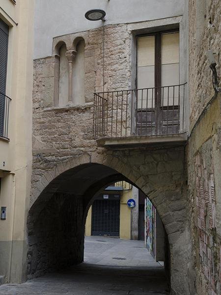Medieval stone street and arch in the historic centre of Manresa